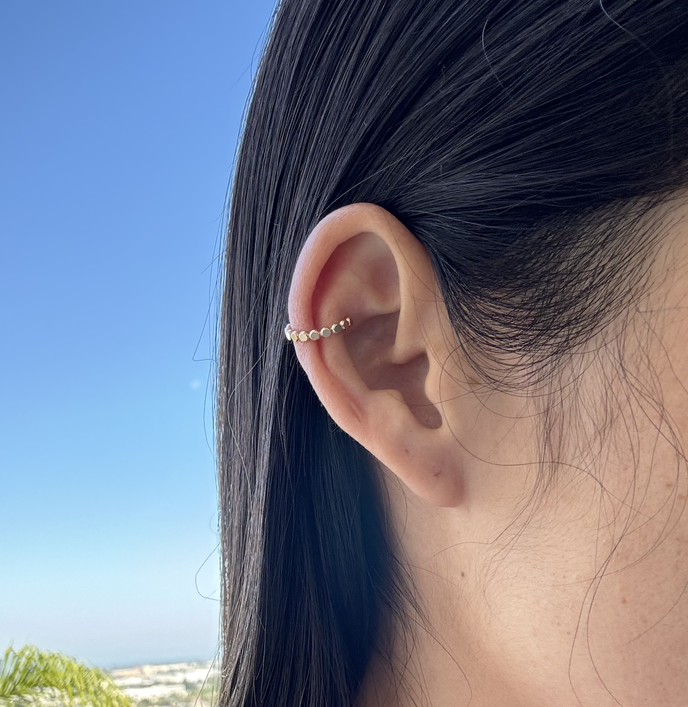 Sample B19 Dot Bead Ear Cuff, sterling silver, on white textured surface